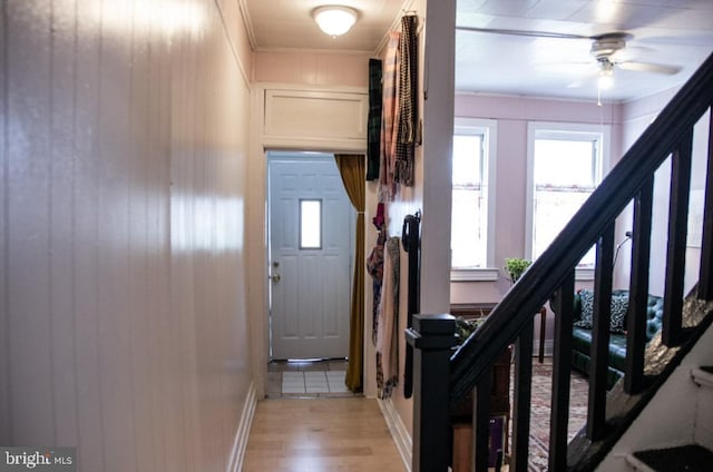 713 E 23rd St, Baltimore, MD 21218 - staircase with ornamental molding, wood finished floors, and a ceiling fan