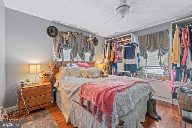 4433 Forest View Ave, Baltimore, MD 21206 - bedroom featuring wood finished floors and a textured ceiling