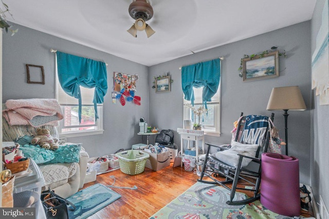 4433 Forest View Ave, Baltimore, MD 21206 - living area with ceiling fan and wood finished floors
