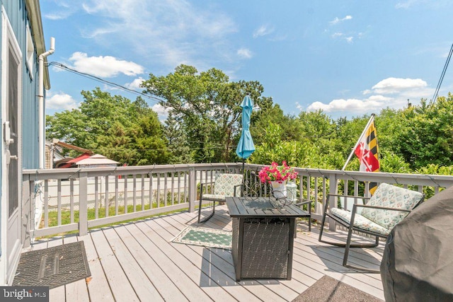 4433 Forest View Ave, Baltimore, MD 21206 - wooden terrace with view of wooded area