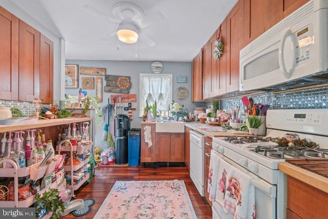 4433 Forest View Ave, Baltimore, MD 21206 - kitchen featuring white appliances, brown cabinetry, decorative backsplash, dark wood-style flooring, and a ceiling fan