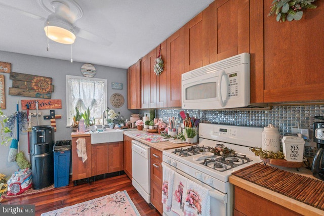 4433 Forest View Ave, Baltimore, MD 21206 - kitchen featuring white appliances, brown cabinetry, dark wood-style floors, backsplash, and light countertops