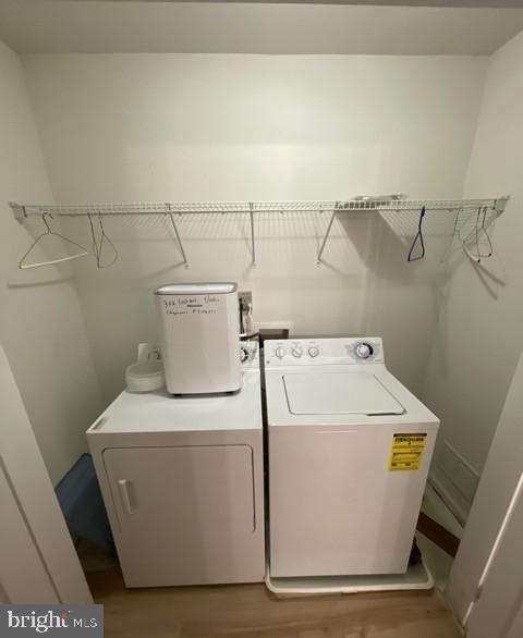 302 Lisa, Cinnaminson, NJ 08077 - laundry area featuring washing machine and clothes dryer and wood finished floors