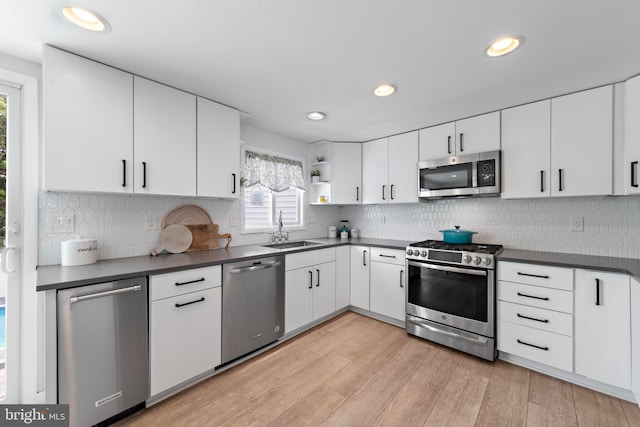 44 Harbor Ln, Long Beach Township, NJ 08008 - kitchen with appliances with stainless steel finishes, dark countertops, open shelves, backsplash, and recessed lighting
