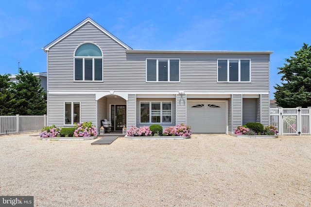 44 Harbor Ln, Long Beach Township, NJ 08008 - view of front facade featuring a garage, a gate, and driveway