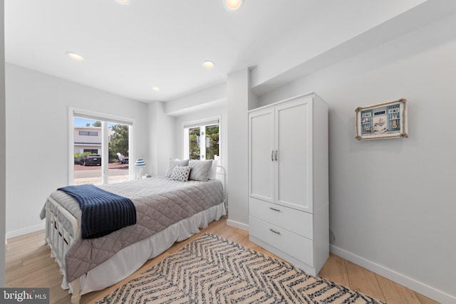 44 Harbor Ln, Long Beach Township, NJ 08008 - bedroom with light wood-style flooring, recessed lighting, and access to outside