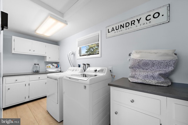 44 Harbor Ln, Long Beach Township, NJ 08008 - laundry area featuring washing machine and clothes dryer, cabinet space, and light wood finished floors
