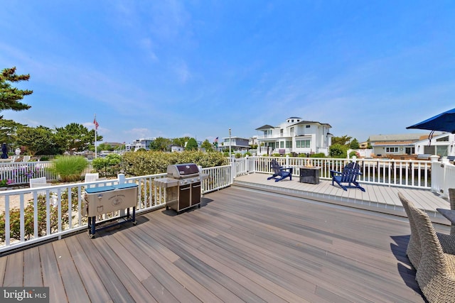 44 Harbor Ln, Long Beach Township, NJ 08008 - wooden terrace with a grill
