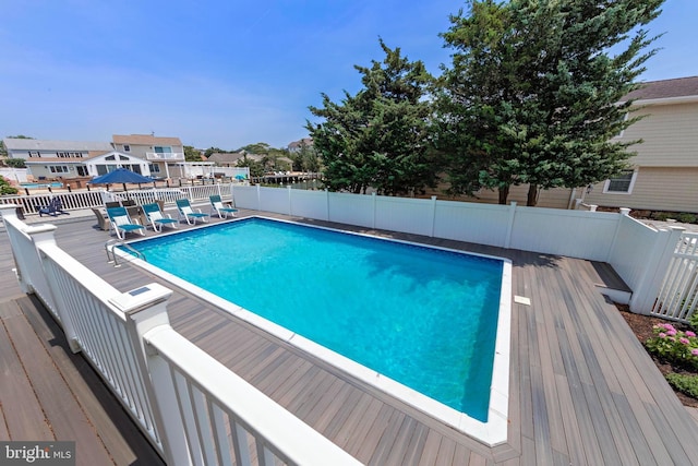 44 Harbor Ln, Long Beach Township, NJ 08008 - view of swimming pool featuring a deck and a fenced backyard