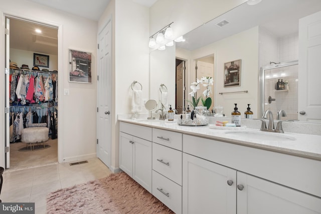 12606 Rosencrans Dr, Hagerstown, MD 21740 - full bath featuring double vanity, a shower stall, tile patterned floors, and a walk in closet