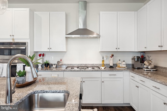 12606 Rosencrans Dr, Hagerstown, MD 21740 - kitchen with wall chimney exhaust hood, gas cooktop, double oven, and white cabinetry