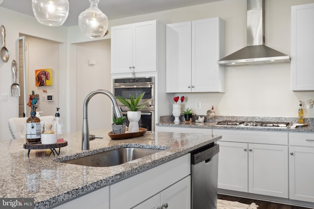 12606 Rosencrans Dr, Hagerstown, MD 21740 - kitchen featuring wall chimney range hood, stainless steel appliances, white cabinets, and light stone countertops
