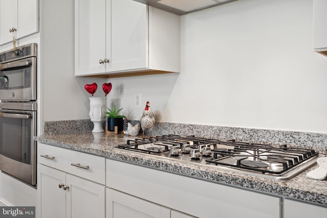 12606 Rosencrans Dr, Hagerstown, MD 21740 - kitchen featuring appliances with stainless steel finishes, white cabinetry, and light countertops