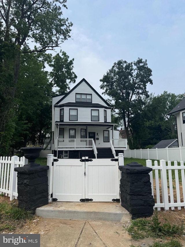 3708 Fairview Ave, Baltimore, MD 21216 - view of front of property featuring a fenced front yard, a porch, and a gate