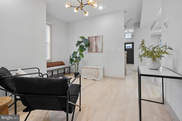 3708 Fairview Ave, Baltimore, MD 21216 - dining room with a chandelier and light wood finished floors