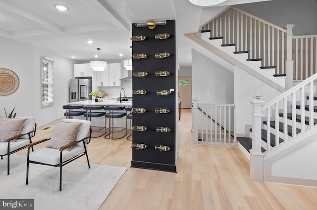 3708 Fairview Ave, Baltimore, MD 21216 - entrance foyer featuring light wood-style floors, beamed ceiling, recessed lighting, and stairway