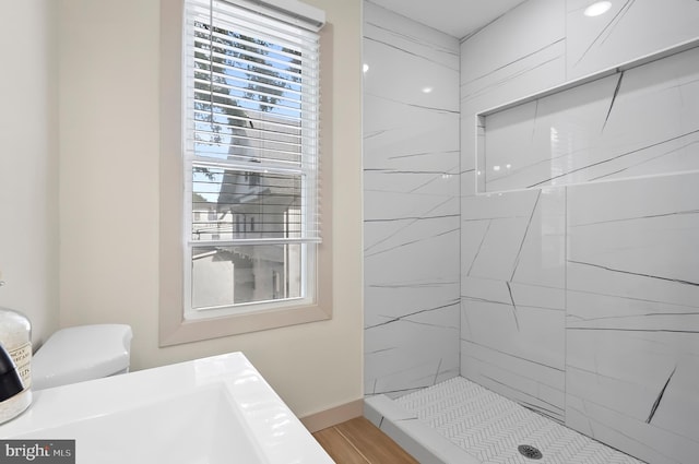 3708 Fairview Ave, Baltimore, MD 21216 - full bath with a tile shower and wood finished floors