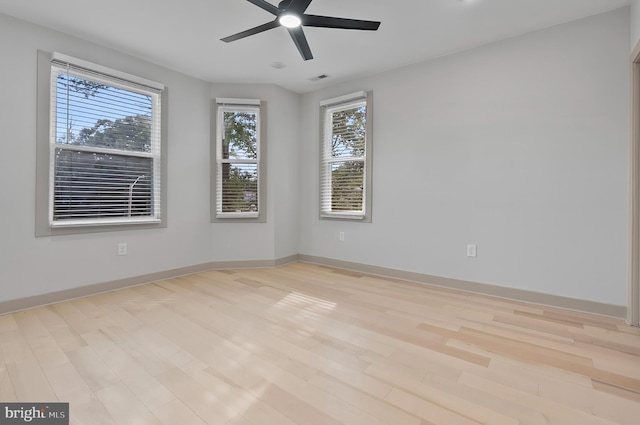 3708 Fairview Ave, Baltimore, MD 21216 - spare room featuring plenty of natural light, wood finished floors, and a ceiling fan