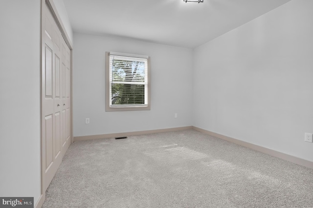 3708 Fairview Ave, Baltimore, MD 21216 - unfurnished bedroom with a closet and carpet flooring