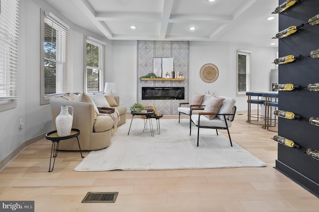 3708 Fairview Ave, Baltimore, MD 21216 - living room featuring a tile fireplace, coffered ceiling, beamed ceiling, recessed lighting, and wood finished floors