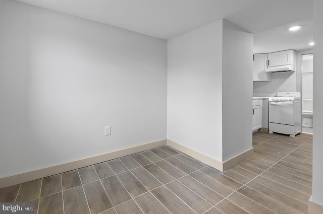 3708 Fairview Ave, Baltimore, MD 21216 - empty room with wood finished floors and recessed lighting