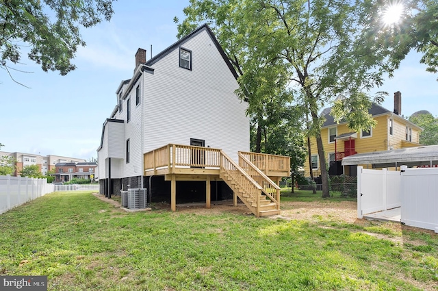 3708 Fairview Ave, Baltimore, MD 21216 - rear view of property featuring a fenced backyard, a wooden deck, stairway, and a chimney