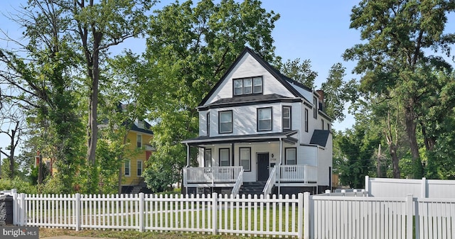 3708 Fairview Ave, Baltimore, MD 21216 - view of front of property featuring a porch and a fenced front yard