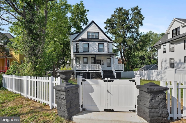 3708 Fairview Ave, Baltimore, MD 21216 - view of front of home with a fenced front yard, a porch, and a gate