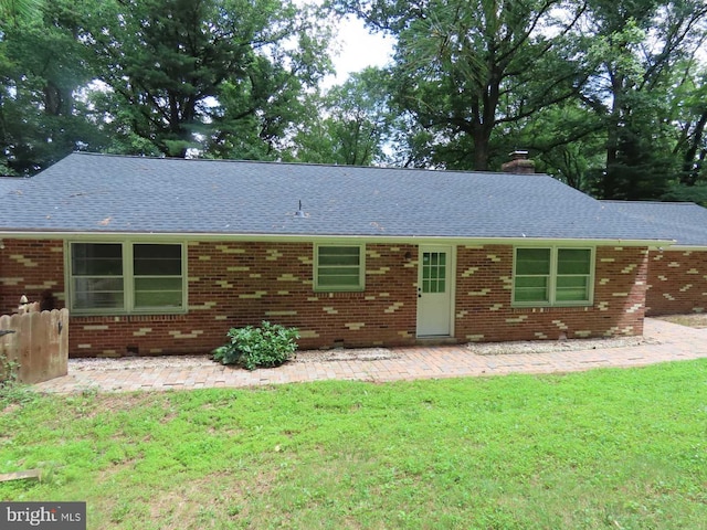 863 Yorklyn Rd, Hockessin, DE 19707 - ranch-style home featuring a shingled roof, a patio, a chimney, and brick siding