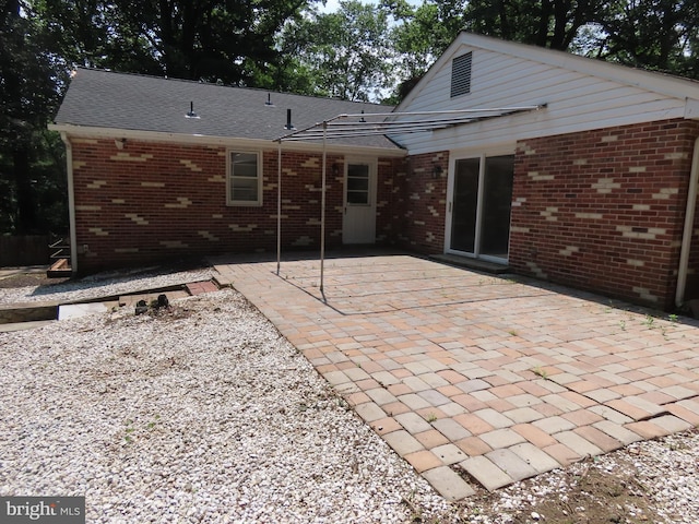 863 Yorklyn Rd, Hockessin, DE 19707 - back of property featuring a patio area and brick siding