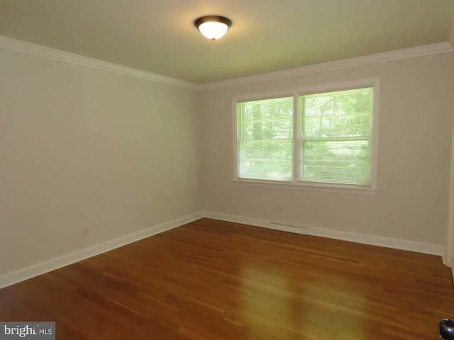 863 Yorklyn Rd, Hockessin, DE 19707 - empty room with wood finished floors and ornamental molding