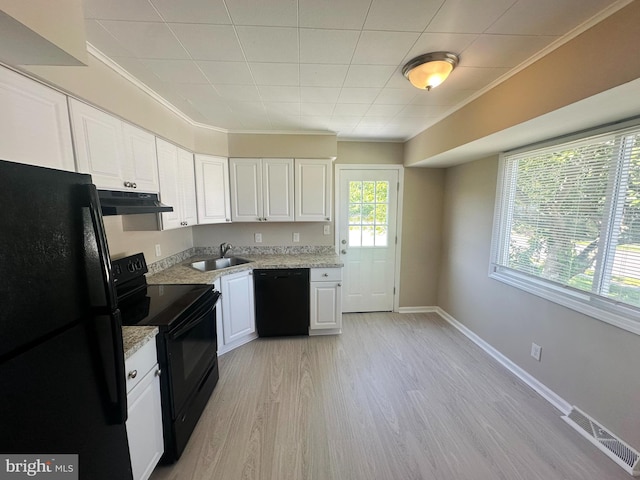 663 Topeka Ave, Mantua, NJ 08051 - kitchen with black appliances, ornamental molding, white cabinetry, under cabinet range hood, and light wood-style flooring