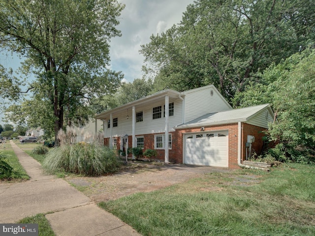 13217 Kephart Ln, Woodbridge, VA 22193 - view of front facade featuring brick siding, an attached garage, and driveway