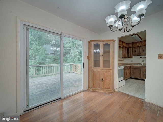 13217 Kephart Ln, Woodbridge, VA 22193 - unfurnished dining area featuring a chandelier and light wood-type flooring