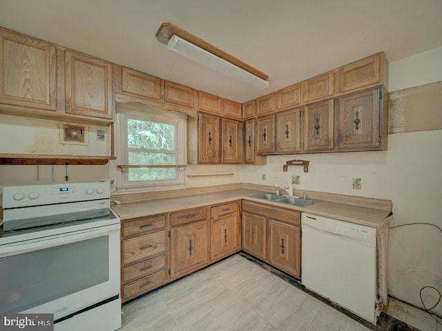 13217 Kephart Ln, Woodbridge, VA 22193 - kitchen featuring white appliances, light countertops, light floors, and light brown cabinets