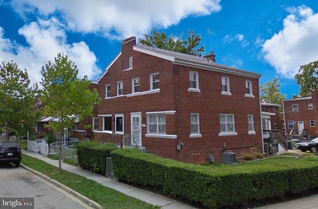 601 Forrester St SE, Washington, DC 20032 - view of property exterior featuring brick siding and a chimney