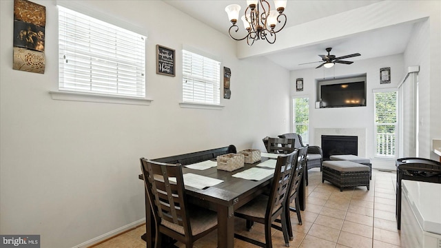 28 Buttonwood Ct, Baltimore, MD 21237 - dining room with a chandelier, light tile patterned flooring, a fireplace, and a ceiling fan