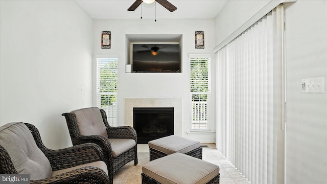 28 Buttonwood Ct, Baltimore, MD 21237 - living area featuring ceiling fan, light tile patterned floors, and a premium fireplace