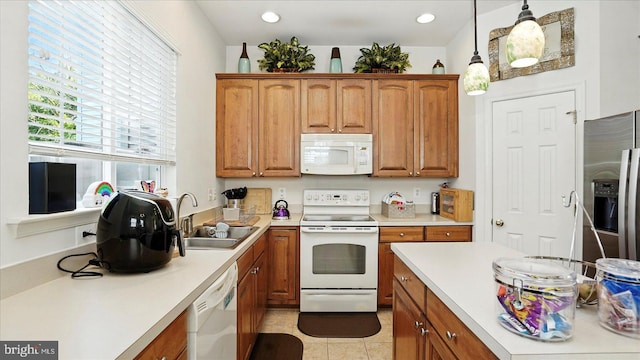 28 Buttonwood Ct, Baltimore, MD 21237 - kitchen with white appliances, light countertops, brown cabinets, pendant lighting, and recessed lighting