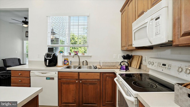 28 Buttonwood Ct, Baltimore, MD 21237 - kitchen with white appliances, a ceiling fan, light countertops, and brown cabinetry