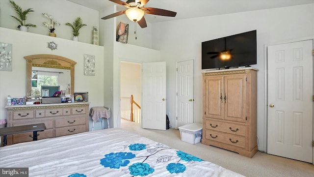 28 Buttonwood Ct, Baltimore, MD 21237 - bedroom featuring light colored carpet, high vaulted ceiling, and a ceiling fan