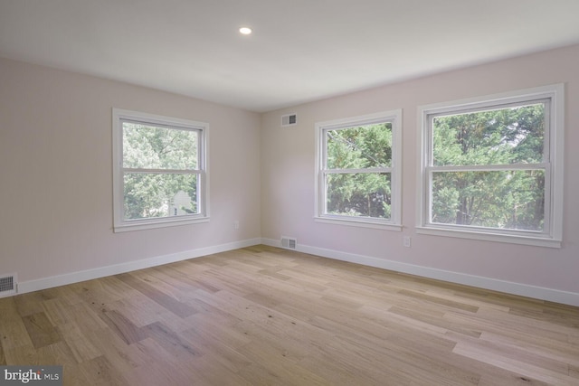 8328 Tuckerman Ln, Potomac, MD 20854 - unfurnished room with light wood-style flooring and recessed lighting