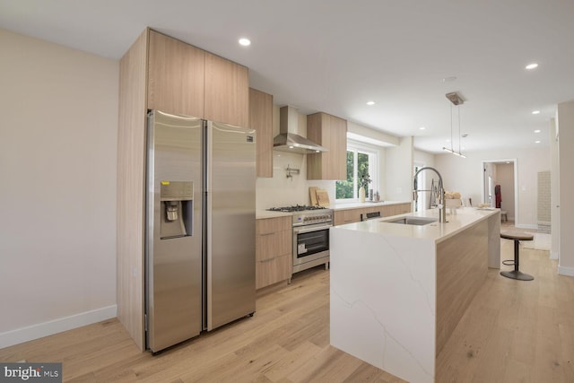 8328 Tuckerman Ln, Potomac, MD 20854 - kitchen featuring stainless steel appliances, modern cabinets, wall chimney range hood, light wood finished floors, and recessed lighting