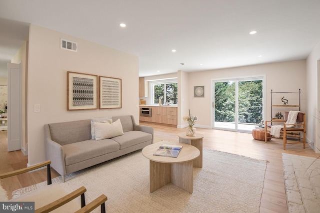 8328 Tuckerman Ln, Potomac, MD 20854 - living area with light wood-style floors and recessed lighting