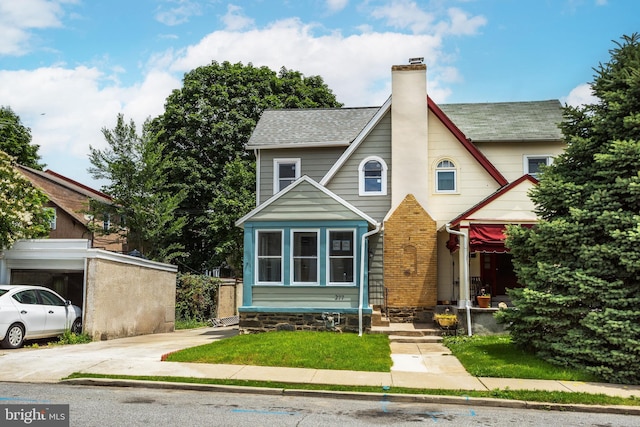 277 Ardmore Ave, Lansdowne, PA 19050 - view of front of property with a chimney, concrete driveway, and roof with shingles