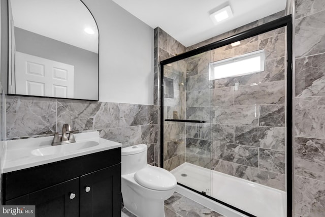 277 Ardmore Ave, Lansdowne, PA 19050 - bathroom with vanity, tile walls, a shower stall, and marble look tile flooring