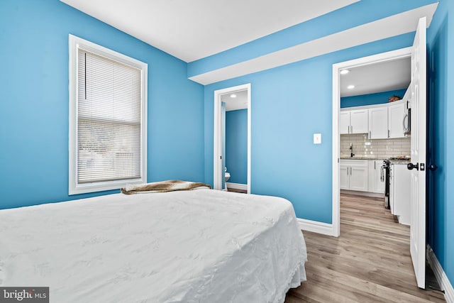 5309 Ethelbert Ave, Baltimore, MD 21215 - bedroom featuring light wood-style flooring, recessed lighting, and ensuite bathroom