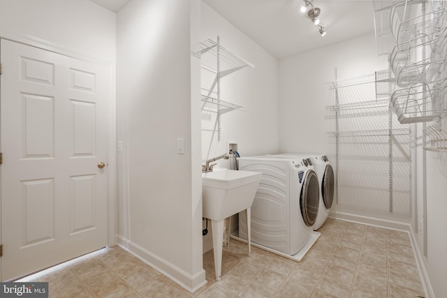 5617 James Gunnell Ln, Alexandria, VA 22310 - laundry area featuring washer and clothes dryer and baseboards