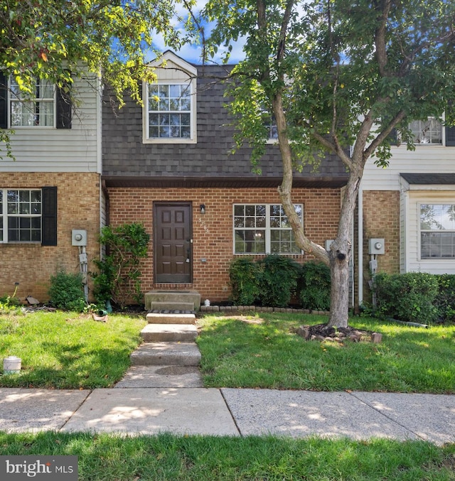 5783 Katsura Ct, Frederick, MD 21703 - view of property featuring brick siding, a front lawn, and a shingled roof