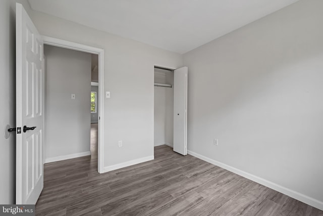 5783 Katsura Ct, Frederick, MD 21703 - unfurnished bedroom with wood finished floors and a closet